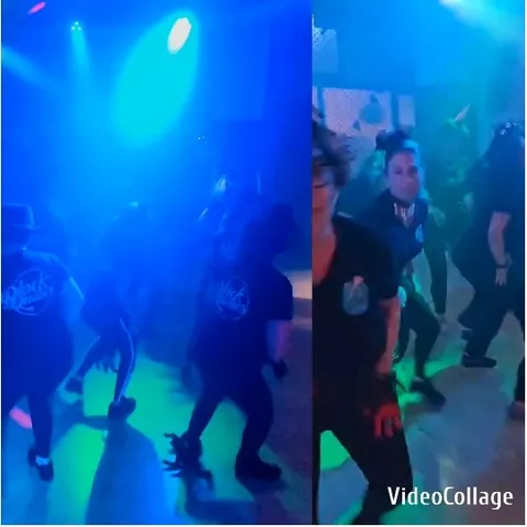 Group Dancing in Colorful Nightclub