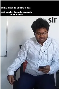 Man Focused on Phone with Whiteboard