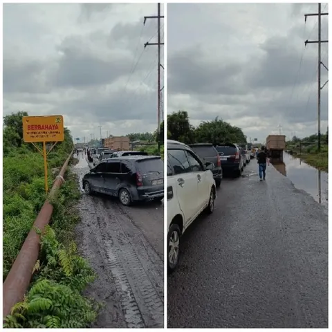 Wet Road with Cars and Warning Sign