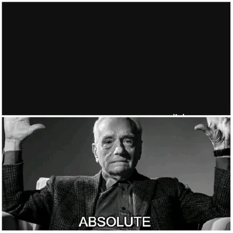 Older Person in Suit Raising Hands