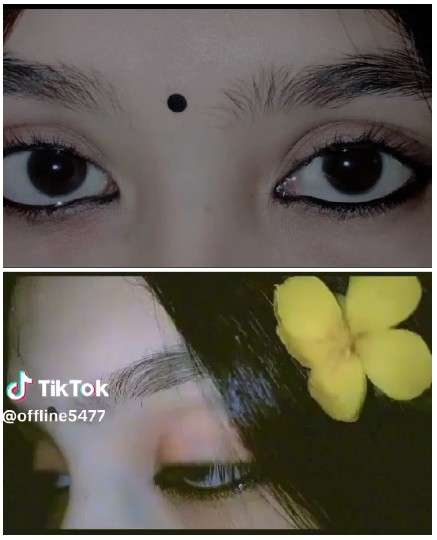 Person's Eyes and Flower in Hair