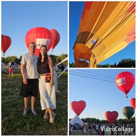 Couple In Field With Hot Air Balloons