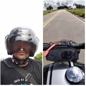 Motorcyclist Taking Selfie On Road