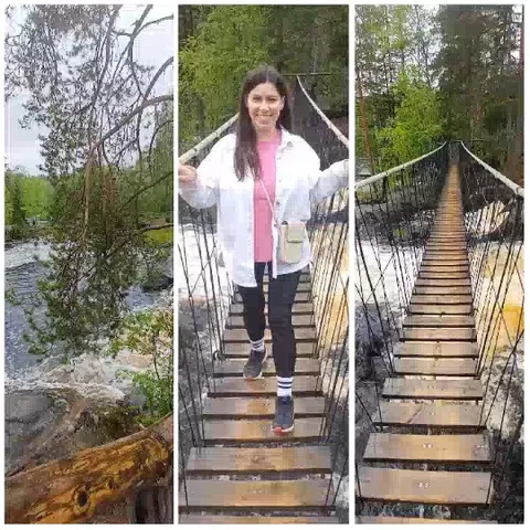 Woman Smiling on Suspension Bridge