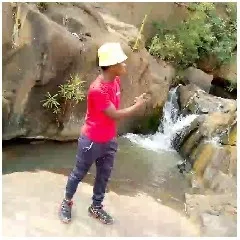 Person by a Small Waterfall