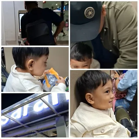 Man with Backpack and Smiling Child