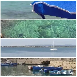 Blue Sunshade and Distant Sailboat