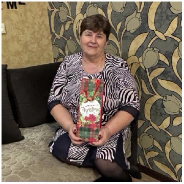 Person with Christmas Gift Bag