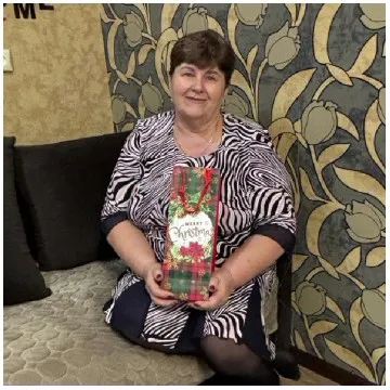 Person with Christmas Gift Bag