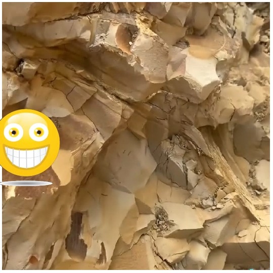 Rocky Surface With Emoji Overlay