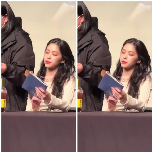 Person with Book at Indoor Event