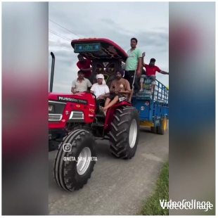 People Riding a Red Tractor