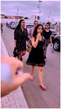 Group of Women Walking on Sidewalk