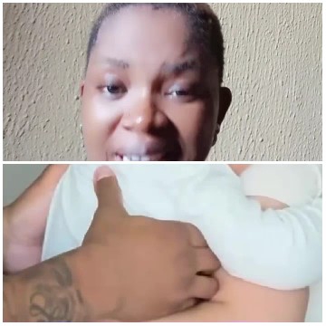 Smiling Person And Cradled Baby