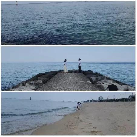 Calm Ocean and Couples on Pier