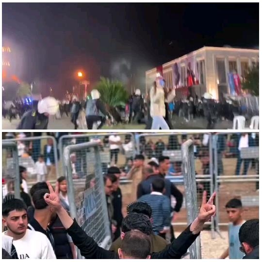 Night Gathering with Flags and Gestures