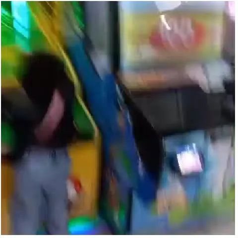 Person Playing in Arcade