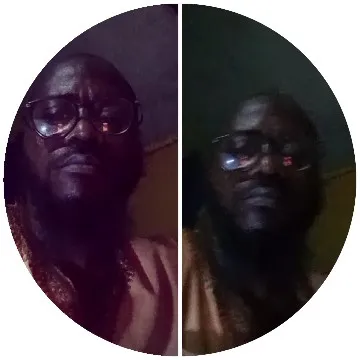 Glasses-Wearing Person in Dim Lighting