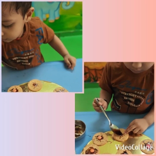 Child Decorating Cookies at Table