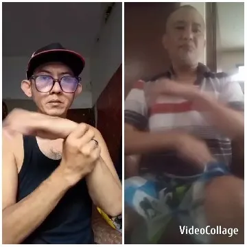 Two People Gesturing Indoors