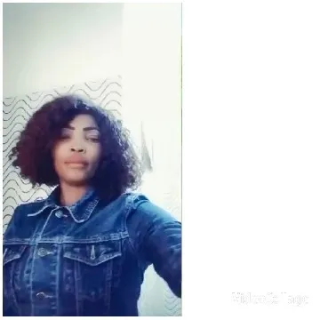 Curly Hair in Denim Jacket Pose