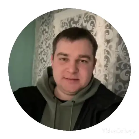Person Smiling with Decorative Curtain