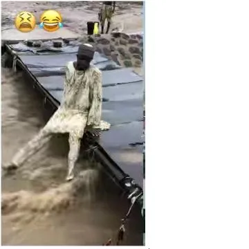 Person Sitting in Flooded Area