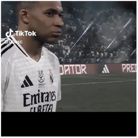 Focused Soccer Player with Crowd