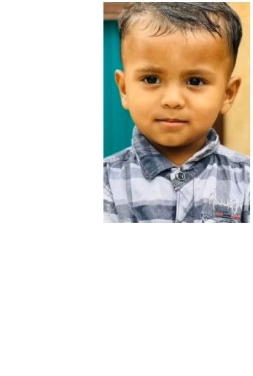 Child Playing on Teal Background
