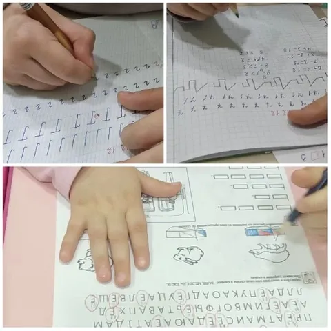 Hands Writing on Worksheets and Graph Paper