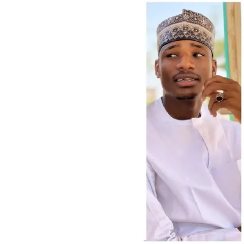 Person in Traditional Attire Sitting
