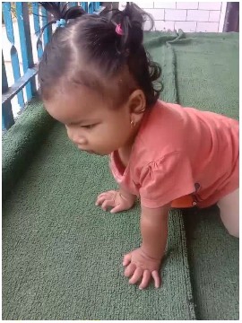 Crawling Child on Green Carpet