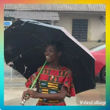 Smiling in Colorful Dress with Umbrella