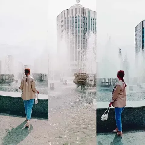 Person by Fountain with Building