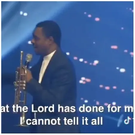 Person with Trumpet on Stage