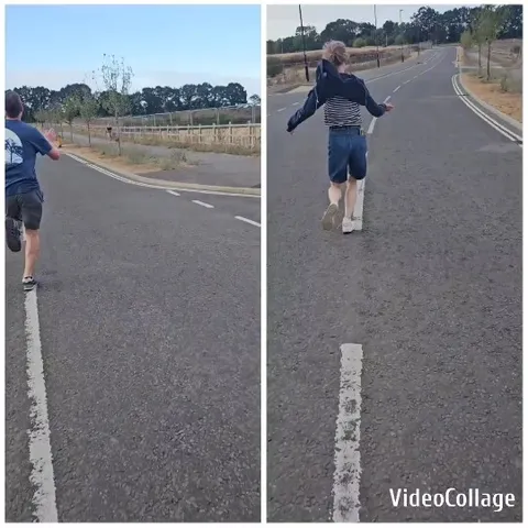 Two People Running on Paved Road