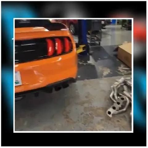Rear View of Orange Car in Garage