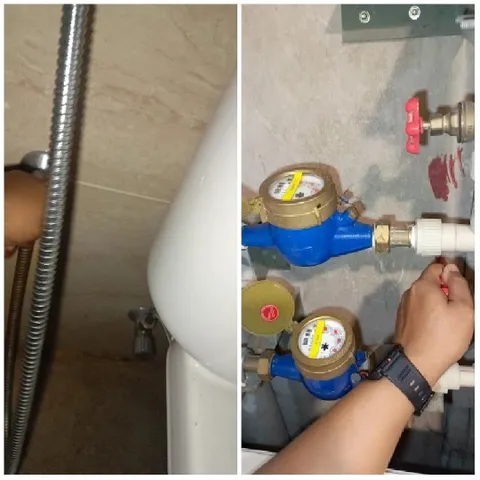 Hand Adjusting Faucet in Bathroom