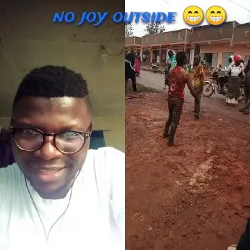 Smiling Man And Muddy Street Scene