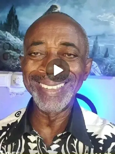 Man Smiling in Front of Painting