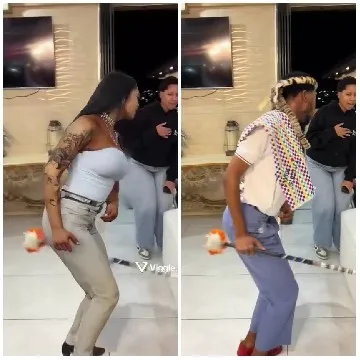 Two People Dancing Indoors