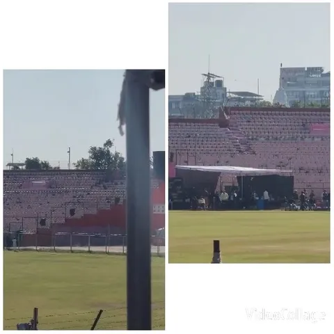 Empty Stadium with Gathering Under Tent