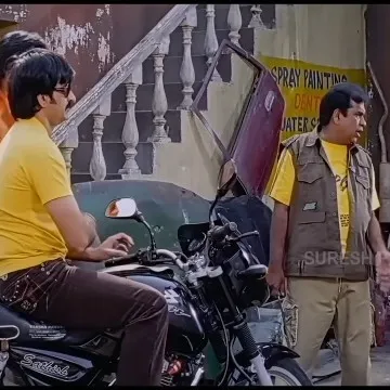 Men by Motorcycle in Garage