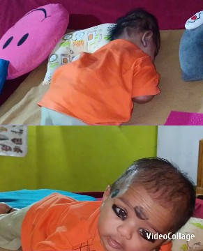 Baby Surrounded by Colorful Blankets