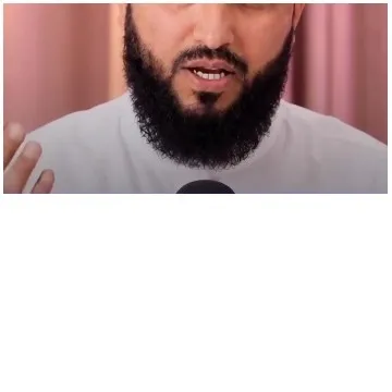 Bearded Man Speaking into Microphone