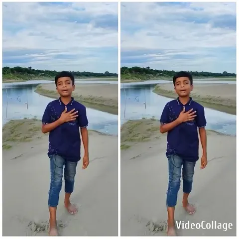 Boy on Riverbank Under Cloudy Sky