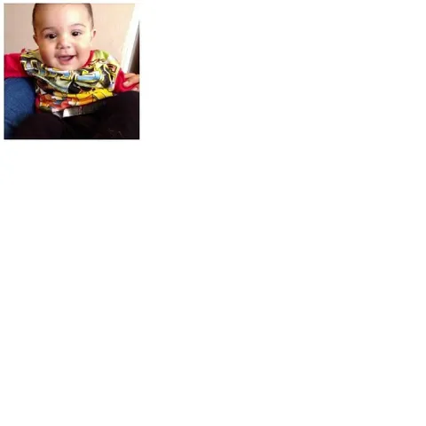 Smiling Baby on Blue Cushion