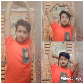 Man Poses with Arms Raised Indoors