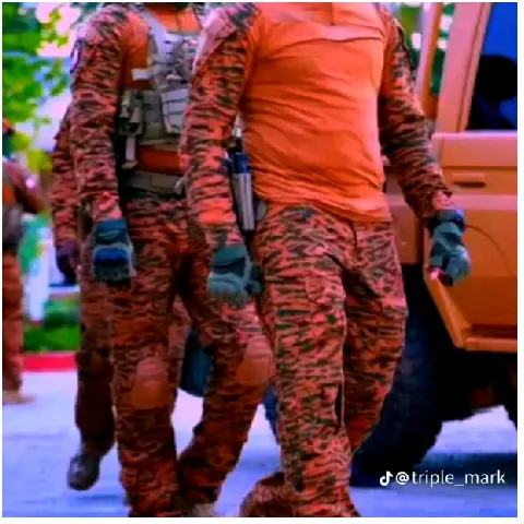 Camouflage Uniforms by a Vehicle