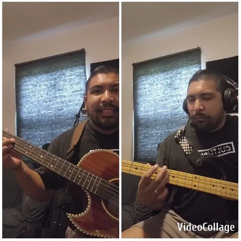 Man Plays Acoustic And Bass Guitar